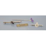 Two early 20th century 9ct gold brooches including gem set bug brooch, a yellow metal stick pin