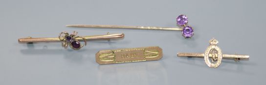 Two early 20th century 9ct gold brooches including gem set bug brooch, a yellow metal stick pin