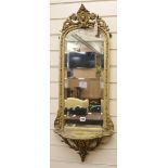 A Victorian carved giltwood and gesso hall mirror W.37cm