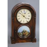 A 19th century walnut mantel clock, with painted glass panel and Roman dial Height 44cm