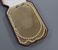 A Mikimoto pearl single strand long necklace with gold ball clasp (tests as 18ct) in Mikimoto box,