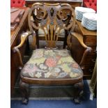 A pair of George I style walnut elbow chairs