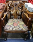 A pair of George I style walnut elbow chairs