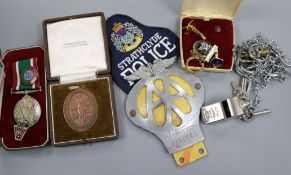 A quantity of badges and medals including Fire Brigade, police etc.