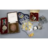 A quantity of badges and medals including Fire Brigade, police etc.