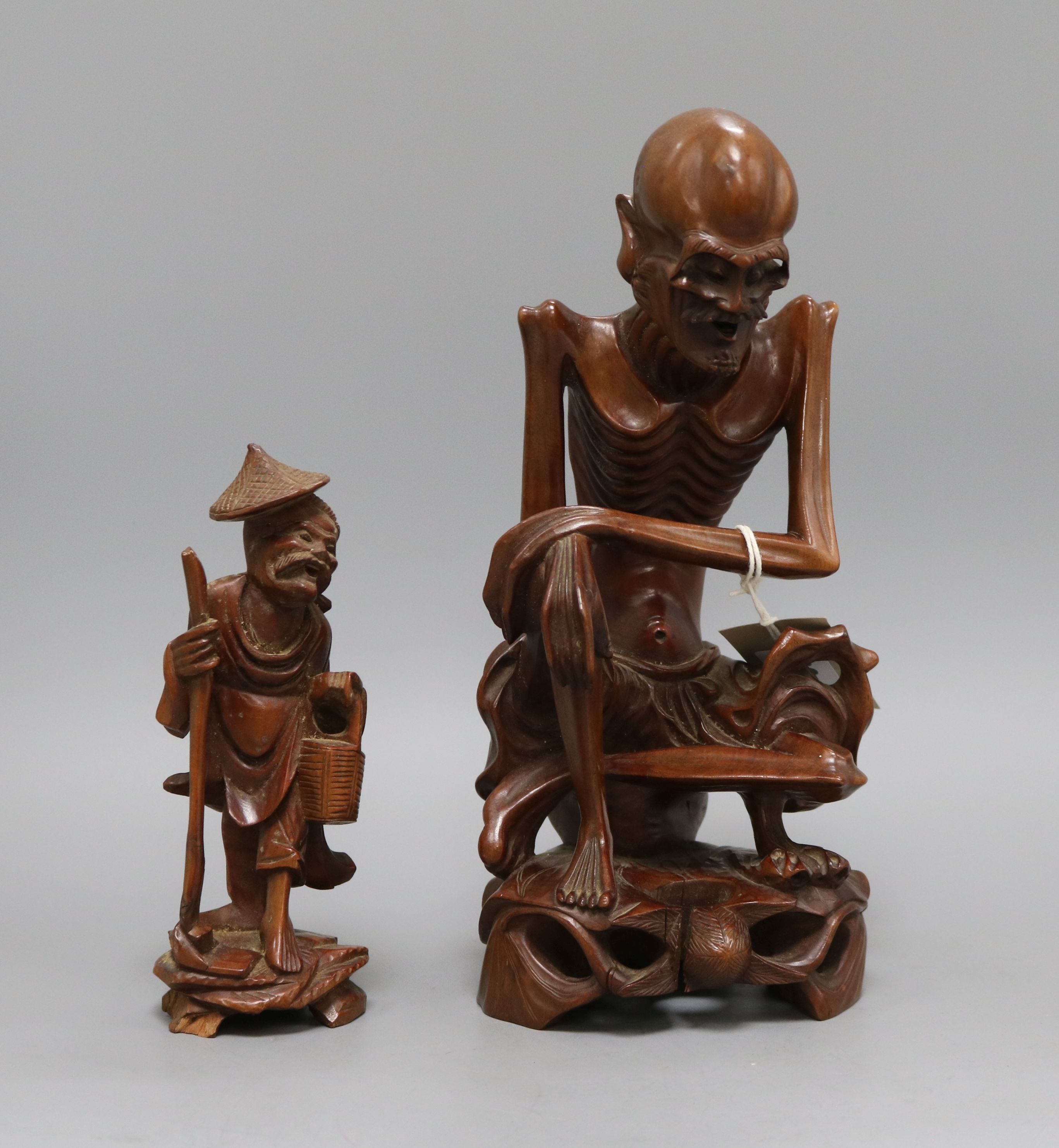 Two Chinese wooden figural carvings tallest 28cm