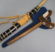 A Chinese Dao sword with rope-bound brass-ended grip and ebonised scabbard and a decorative Kris-