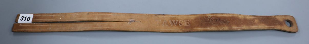 A Scottish leather tawse (school strap)