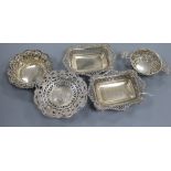 A pair of George V pierced silver bonbon dishes, two other pierced dishes and a pierced silver