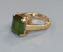 A small 9ct gold and a green tourmaline set ring, size B.