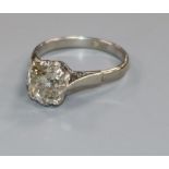 A platinum and solitaire old cushion cut diamond ring, the stone weighing approximately 2.80cts,