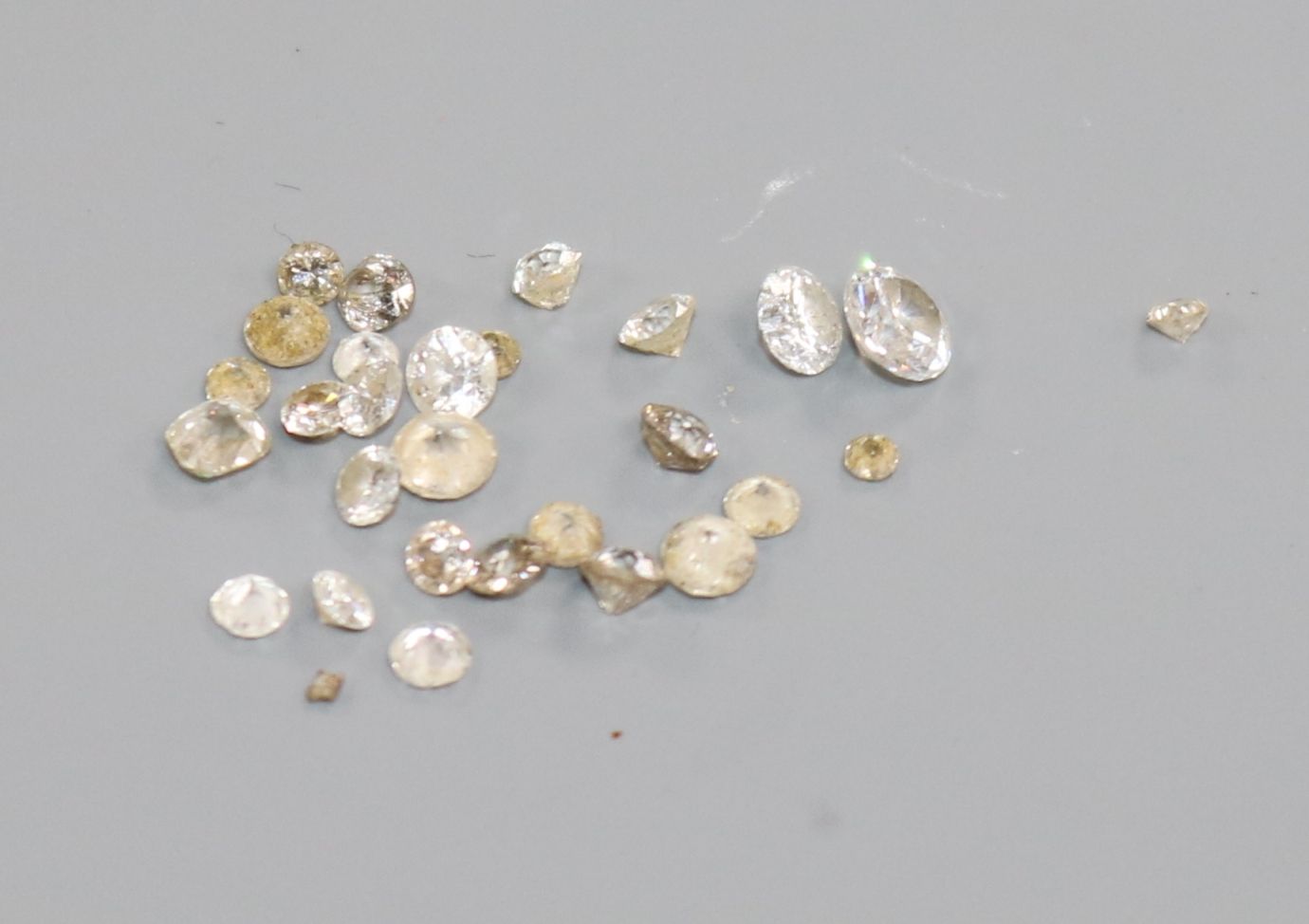 A small quantity of loose cut unmounted stones including diamond.