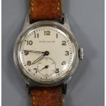A gentleman's 1940's stainless steel Movado mid size manual wind wrist watch.
