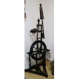 An early 19th century spinning wheel height 104cm