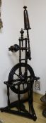 An early 19th century spinning wheel height 104cm