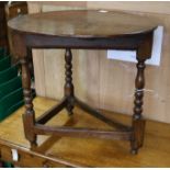 A small oak cricket table W.67cm