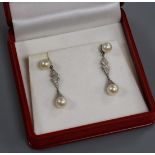 A pair of modern white metal, cultured pearl and diamond drop earrings, 34mm.