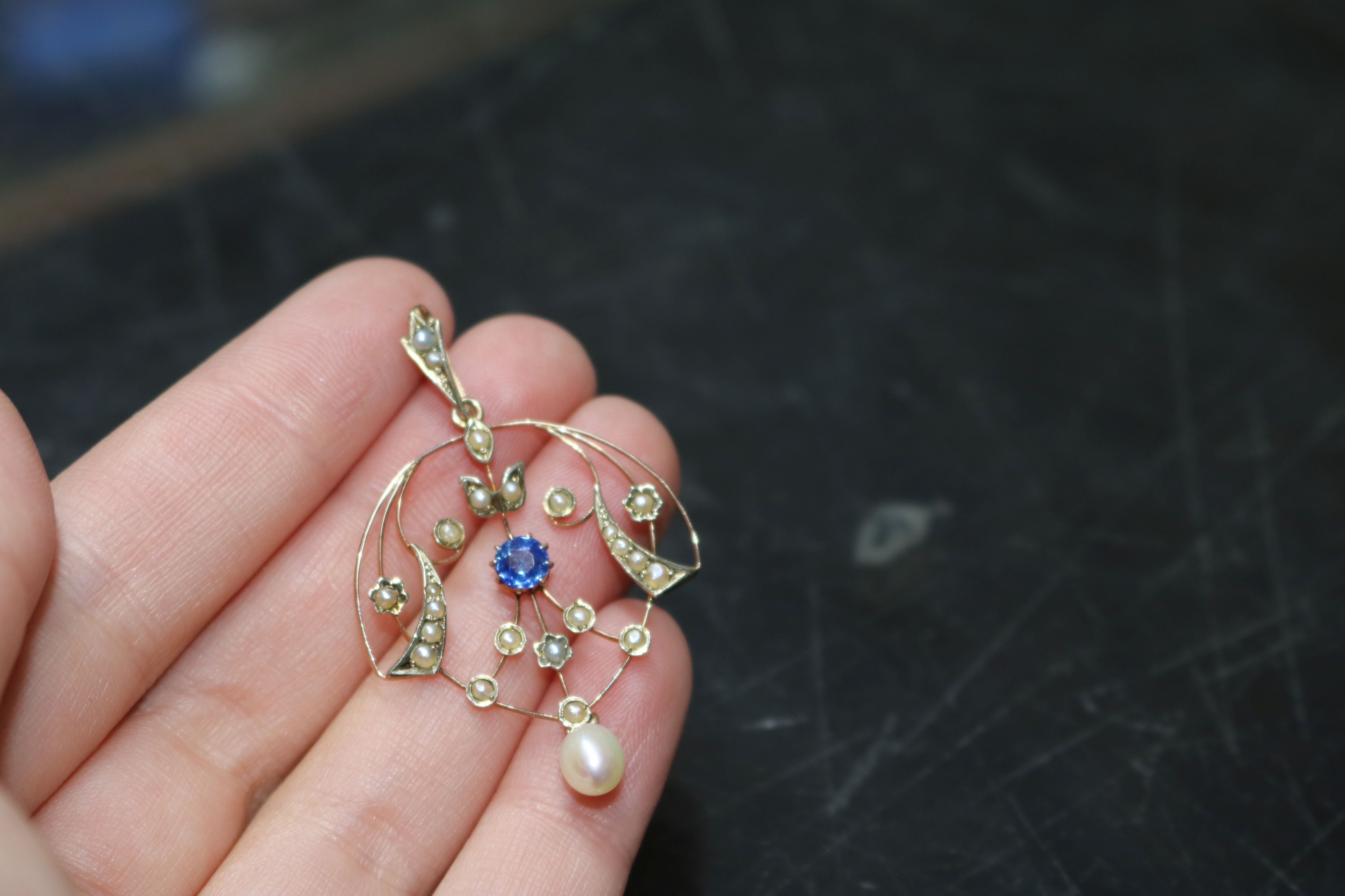 An Edwardian 9ct gold, sapphire and seed pearl set drop pendant, 36mm. - Image 3 of 5