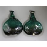 Two 17th century green glass bottles