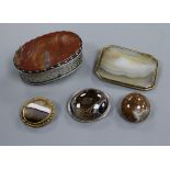 A Georgian white metal and jasper hardstone oval snuff box and four hardstone brooches including