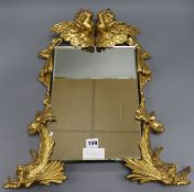 A carved gilt cherub small mirror Height 54cm
