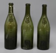 Three 19th/20th century sealed wine bottles, embossed seal 'F M' 30cm high