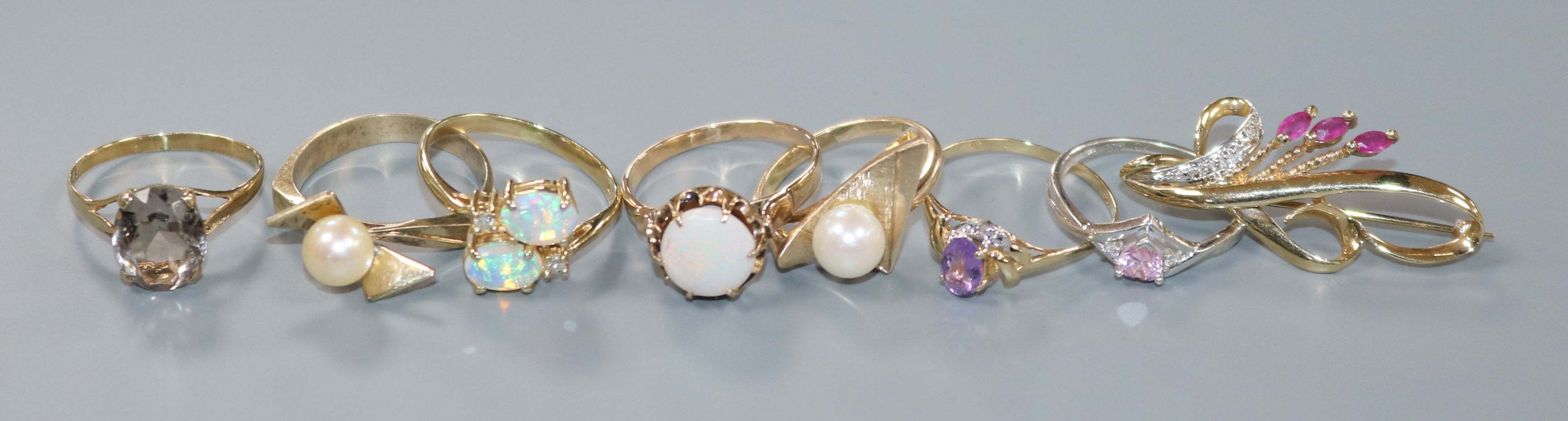 A modern 10ct gold, opal and diamond ring, six other gem set rings including five 9ct and a 9ct