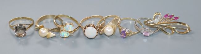 A modern 10ct gold, opal and diamond ring, six other gem set rings including five 9ct and a 9ct