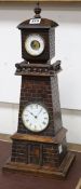 A late Victorian carved oak "Lighthouse " clock barometer by Frank Flower of St James