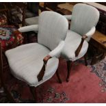 A pair of French walnut fauteuils