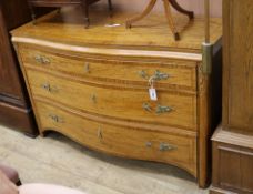 A Continental satinwood serpentine commode W.138cm