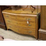 A Continental satinwood serpentine commode W.138cm