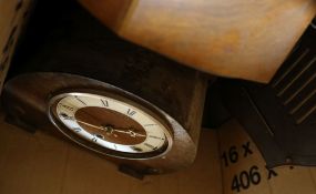 A box of assorted mantel clocks