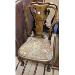 A pair of George I style walnut and parcel-gilt dining chairs