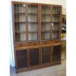 A 1920's leaded light oak library bookcase W.152cm