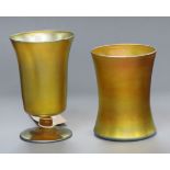 Two Tiffany favrille iridescent glass cups, engraved mark 'L C Tiffany favrille' Tallest 12cm