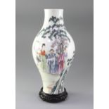 A Chinese famille rose baluster shaped vase, 20th century, finely painted with scholars and