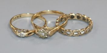 Three 9ct gold and diamond set rings.