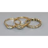 Three 9ct gold and diamond set rings.