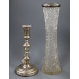 A 1920's silver candlestick and a late Victorian silver mounted tall glass vase.