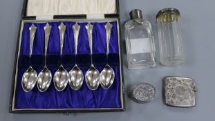 A cased set of six silver teaspoons, a silver vesta case, tow toilet bottles and a pill box.