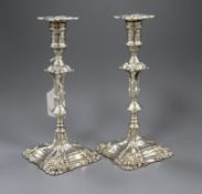 A pair of Edwardian George II style silver candlesticks (weighted), Thomas A. Scott, Sheffield 1902,