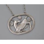 A Danish Georg Jensen sterling silver oval kneeling deer pendant on chain, no.95, 1933-1944 mark,