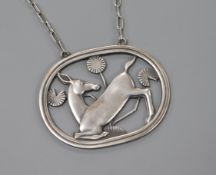 A Danish Georg Jensen sterling silver oval kneeling deer pendant on chain, no.95, 1933-1944 mark,