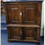 A small oak press cupboard W.113cm