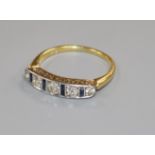 A mid 20th century 18ct gold, sapphire and diamond half hoop ring, size J.