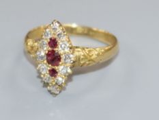 An early-mid 20th century 18ct gold, ruby and diamond marquise cluster ring, size M.