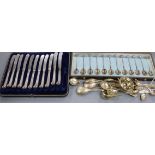 A set of six French 19th century gilt white metal coffee spoons, eleven 800 spoons and tongs, a