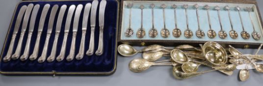 A set of six French 19th century gilt white metal coffee spoons, eleven 800 spoons and tongs, a