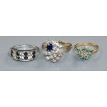 Three assorted 18ct gold and gem set dress rings including sapphire and diamond.